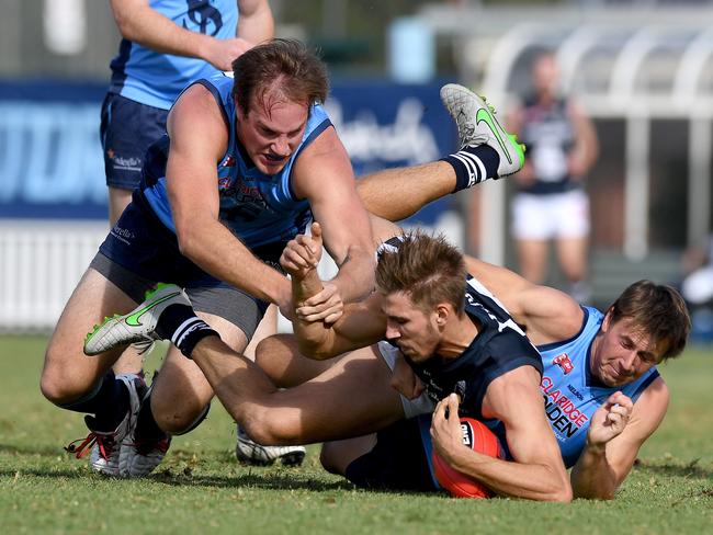 14/05/2016 Sturt verse South Adelaide at Unley oval.South's Tyson Brown crashes between Sturts Jack Osborn and Brodie Martin. Pic Mark Brake