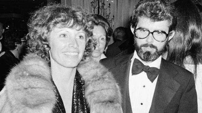 Marcia Lucas, wife of director George Lucas, right, carries her Oscar statuette as they arrive at a post Academy Awards party at the Beverly Hilton Hotel in Los Angeles, Ca., April 4, 1978. She won for best achievement in film editing for "Star Wars," directed by her husband. (AP Photo)