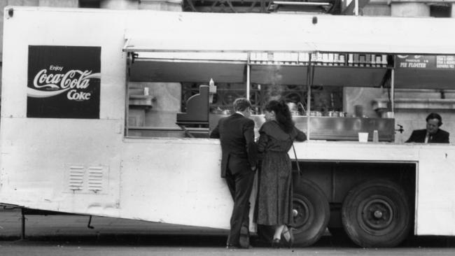 Premier John Bannon and his wife, Angela at Cowley's Pie Cart outside the GPO in Franklin Street, Adelaide in 1990.