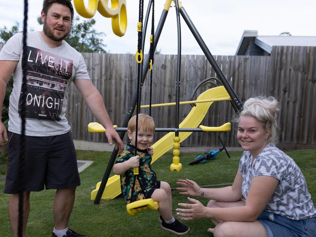 Aaron Harrison and Nikki Hufton with their oldest child, 2-year-old Jaxon. Picture: David Kelly