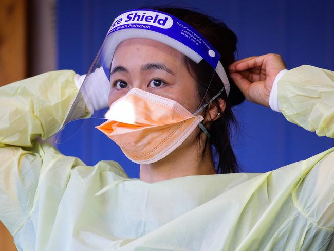 SYDNEY, AUSTRALIA - NewsWire Photos APRIL 05, 2021:  A nurse is seen adjusting her protective face mask while working at the Covid Testing Clinic at the Royal North Shore Hospital on Easter Monday afternoon in Sydney, Australia. Picture: NCA NewsWire / Gaye Gerard