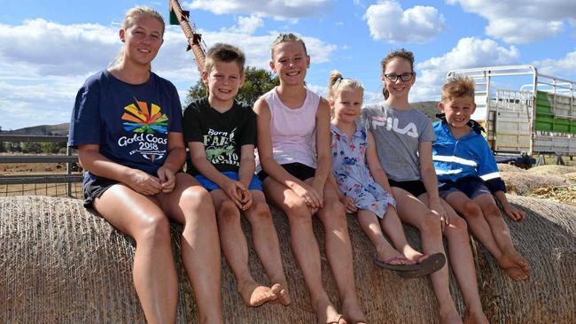 The fifth generation of the Radel family are already keen about helping out on the Happy Valley Dairy Farm at Coalstoun Lakes. Picture: Erica Murree