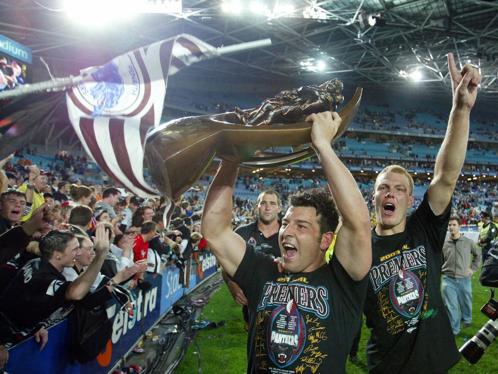 Captain Craig Gower celebrates with teammates and Telstra Cup during lap of honour after Penrith Panthers defeated the Sydney Roosters in the 2003 NRL Grand Final.