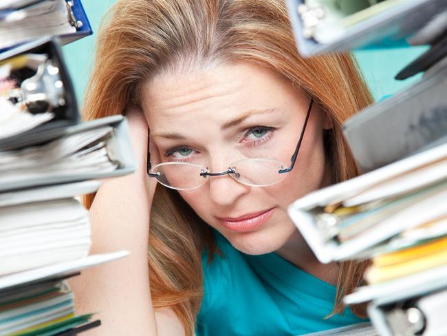 Adult Student or Teacher Frustrated With Work To Do.