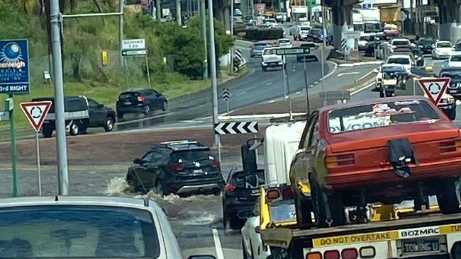 Logan's worst roads: Beenleigh roundabout where cars are forced to drive through a large puddle.