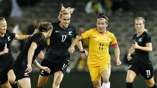 Matildas captain Lisa De Vanna weaves her way through Kiwi defenders.