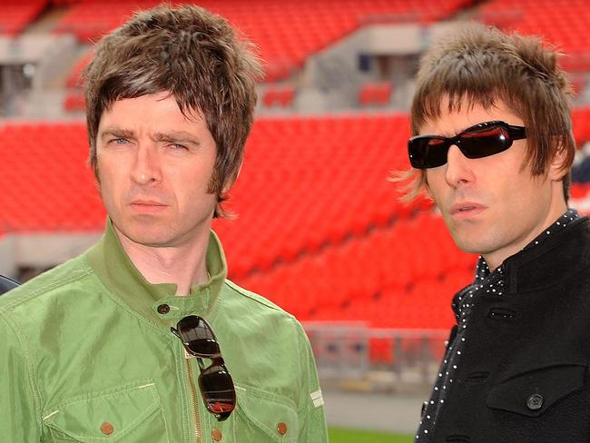 LONDON, ENGLAND - OCTOBER 16:  Noel Gallagher (left) and Liam Gallagher of Oasis pose at Wembley Stadium on October 16, 2008 in London, England. (Photo by Samir Hussein/Getty Images)