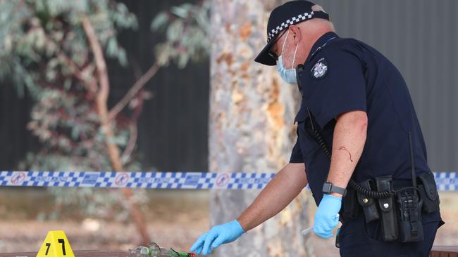 Police gather evidence at Fraser Street Reserve in Hoppers Crossing after an alleged stabbing. Picture: Brendan Beckett