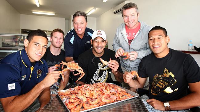 Broncos team members Antonio Winterstein, Steven Michaels, David Green, Justin Hodges, Paul Green and Israel Folau with a tray of prawns. We’re not sure why.