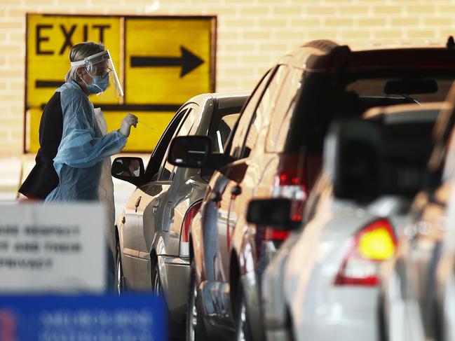 People queue up for a COVID-19 test in Melbourne. Picture: Daniel Pockett