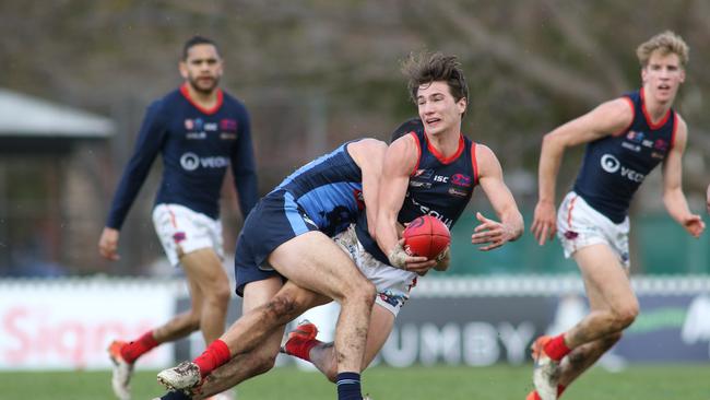 Sturt’s Matthew Crocker brings down Norwood's Josh Richards. Picture: AAP IMAGE/ Russell Millard