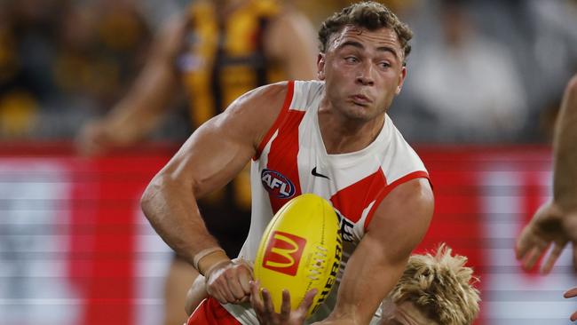 MELBOURNE , AUSTRALIA. April 27, 2024.  AFL...  Hawthorn vs Sydney at the the MCG.  Sydneys Will Hayward clears by hand    . Pic: Michael Klein