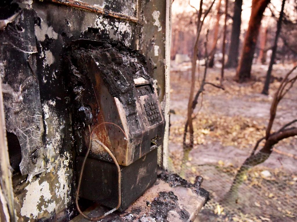 Melted payphone close to Sydney near the dangers Gospers Mountain fire. Picture: WWW.MATRIXNEWS.COM.AU