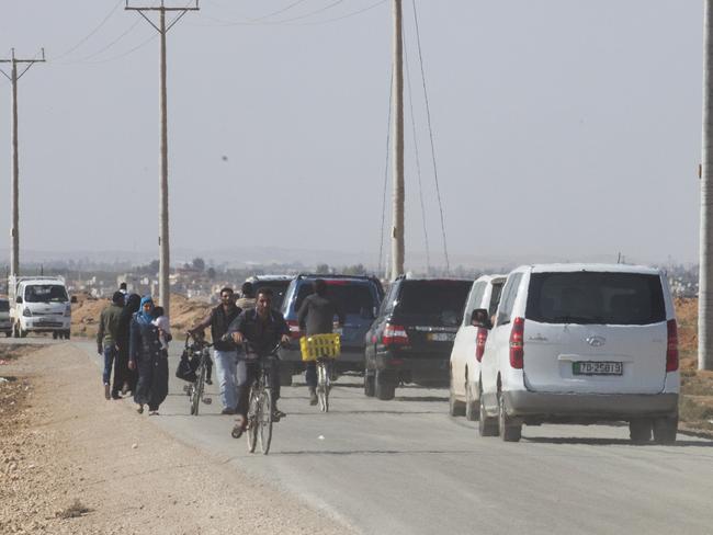 Official visit ... Peter Dutton’s convoy travels inside the Za’atari camp. Picture: Ella Pellegrini