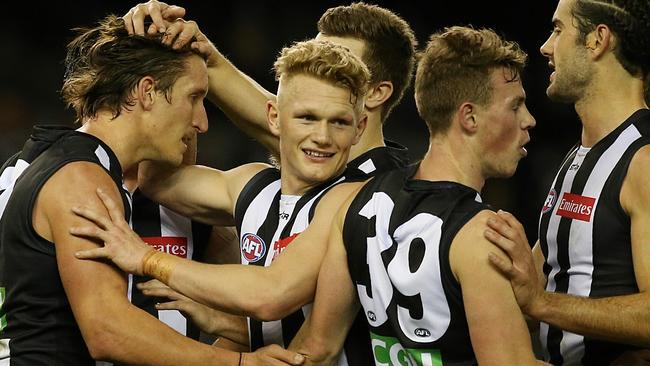 Collingwood players celebrate a goal. Picture: Wayne Ludbey