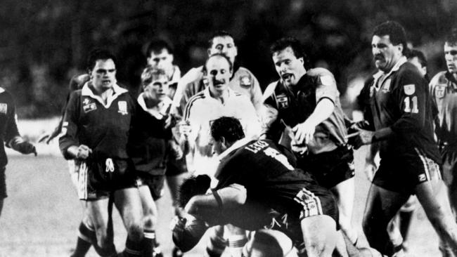 Second half skirmish during State of Origin match at Lang Park 1988, with Tony Currie left, looking on. Wally Lewis, centre, has a NSW player.