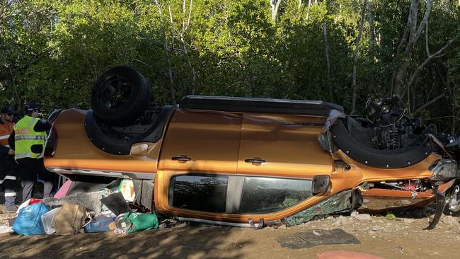 Police inspect where a vehicle and trailer has come off a bridge and rolled down a river bank south of Mackay. Picture: Janessa Ekert.