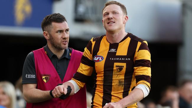 Hawthorn captain James Sicily is helped on the sidelines after re-injuring his shoulder against West Coast on Sunday. Picture: Will Russell / Getty Images