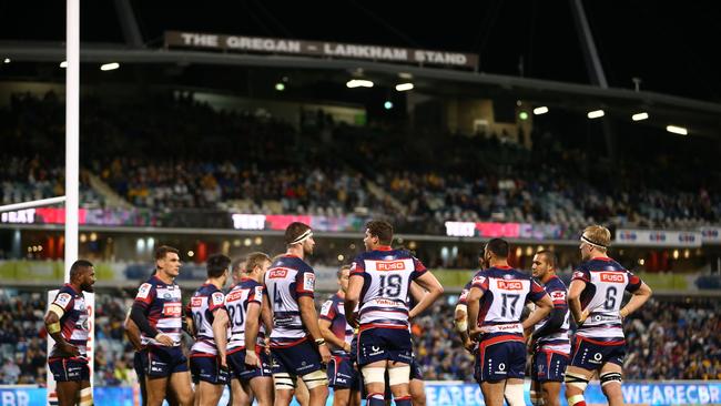 The Rebels gather behind the goal line after a Brumbies try at GIO Stadium.