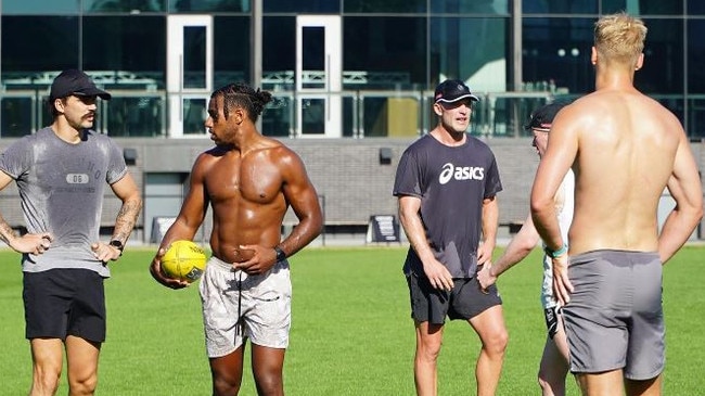 Oleg Markov (left) with Isaac Quaynor at a session with other Magpies players. Picture: Ball Magnets Instagram