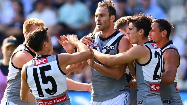 Jeremy Finlayson is congratulated by teammates as Port surges back into the contest. Picture: Getty Images