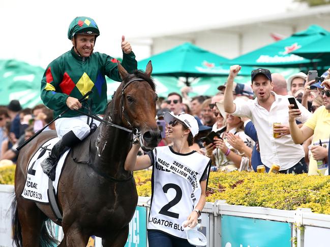 Jockey Ryan Maloney celebrates after riding Alligator Blood to victory in race 6, the Magic Millions 3YO Guineas, during Magic Millions Race Day at Aquis Park on the Gold Coast. Saturday, January 11, 2020. (AAP Image/Jono Searle) NO ARCHIVING, EDITORIAL USE ONLY