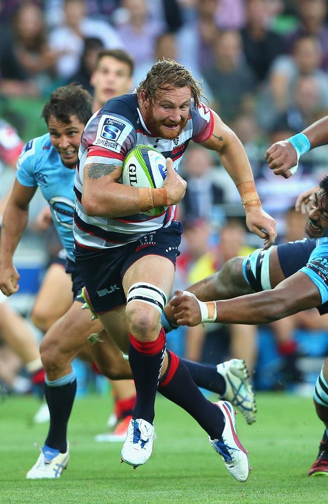 Scott Higginbotham barges through the Waratahs defence.