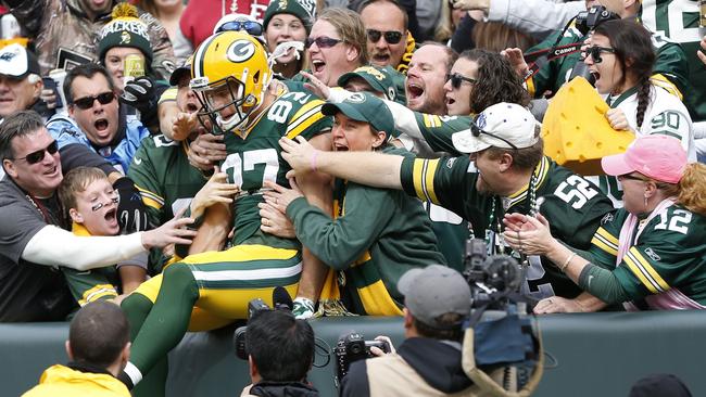 Jordy Nelson celebrates with fans after a 59-yard touchdown pass reception.