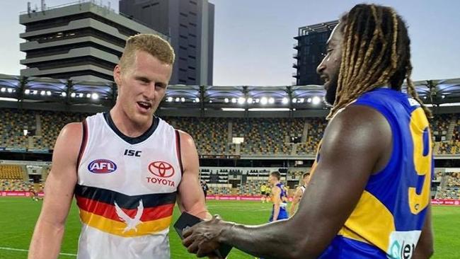 The moment Nic Naitanui gave Reilly O’Brien a phone post-game. Picture: 9News