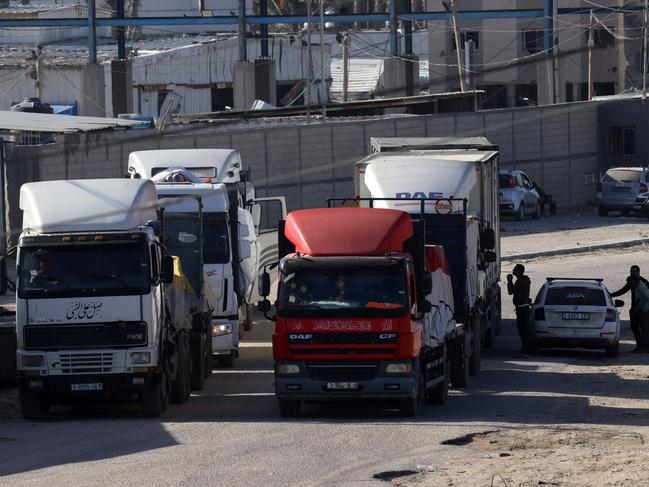 Trucks carrying humanitarian aid enter the Gaza Strip via the Rafah crossing with Egypt, hours after the start of a four-day truce in battles between Israel and Palestinian Hamas militants. Picture: AFP