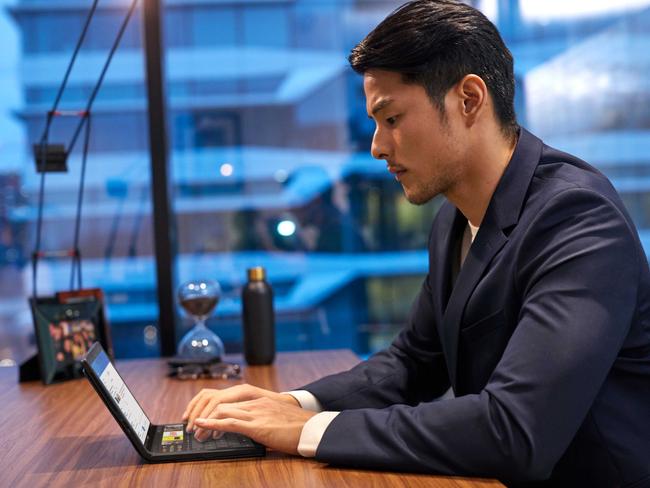 Half-sized laptop mode with the mini keyboard attached magnetically to the bottom half of the display.