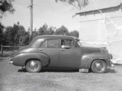 John ‘Jack’ Tuck with his first car, an FJ Holden, in Liverpool, Sydney in 1956.