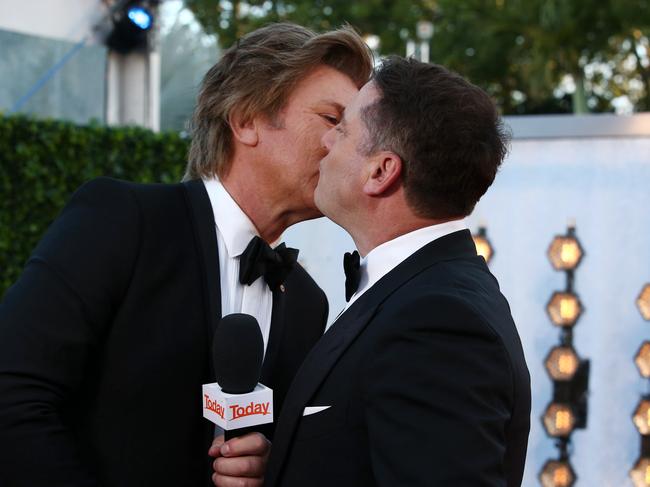 Bromance ... Richard Wilkins and Karl Stefanovic kiss on the cheek. Picture: Matrix