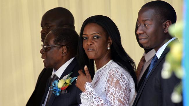 Grace Mugabe with her husband, with flowers, last week at a ceremony to rename Harare International airport to Robert Gabriel Mugabe International Airport. Picture: AP