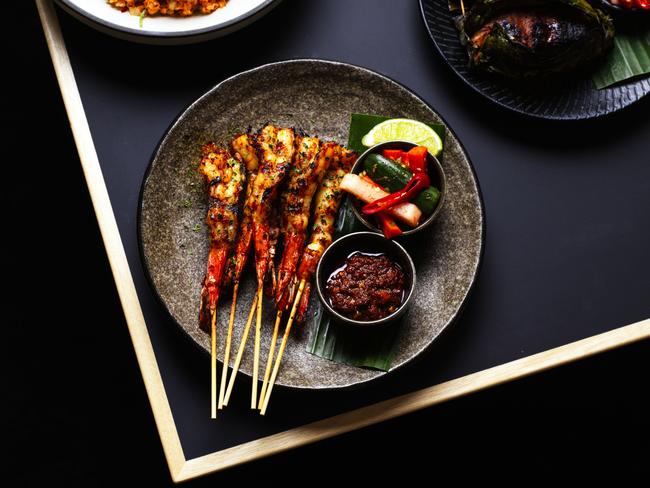 The Malaya’s BBQ Lemak Prawns with spicy coconut, lemongrass and kaffir lime lemak sauce. Picture: Jason Loucas