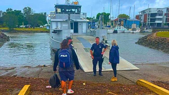 Russell Island man Joshua Doyle with Redlands MP Rebecca Yougn as he prepares to board the Stewart Kerlin barge at Weinam Creek where he spent the night in the ticketoffice. PICTURE: Judith Kerr