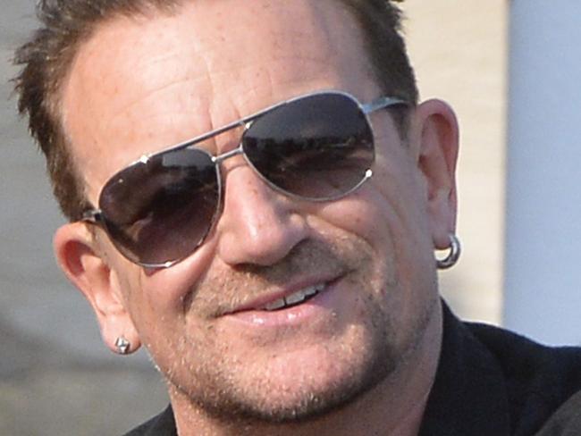 Irish singer and frontman of U2, Bono, arrives on September 27, 2014 at the Cipriani Hotel in Venice for the wedding of US actor george Clooney with British Amal Alamuddin in Venice. George Clooney has said goodbye to bachelorhood in Venice with a stag party at his favourite restaurant with Hollywood chums, and was gearing up for a day of glamourous pre-wedding celebrations. The actor had swept into the floating city yesterday with his British fiancee Amal Alamuddin on a watertaxi dubbed "Amore", zipping up the Grand Canal to cheers from fans at the start of nuptials set to draw out over the weekend. AFP PHOTO / ANDREAS SOLARO