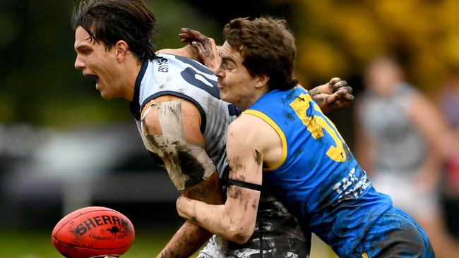 Old Geelong’s Lachlan Dunell is tackled by Josh Cumberlidge of De La Salle. Picture: Josh Chadwick