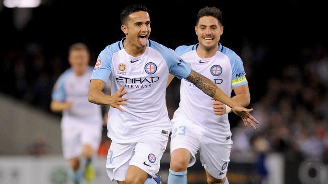 Tim Cahill celebrates after scoring his goal. (AAP Image/Joe Castro)