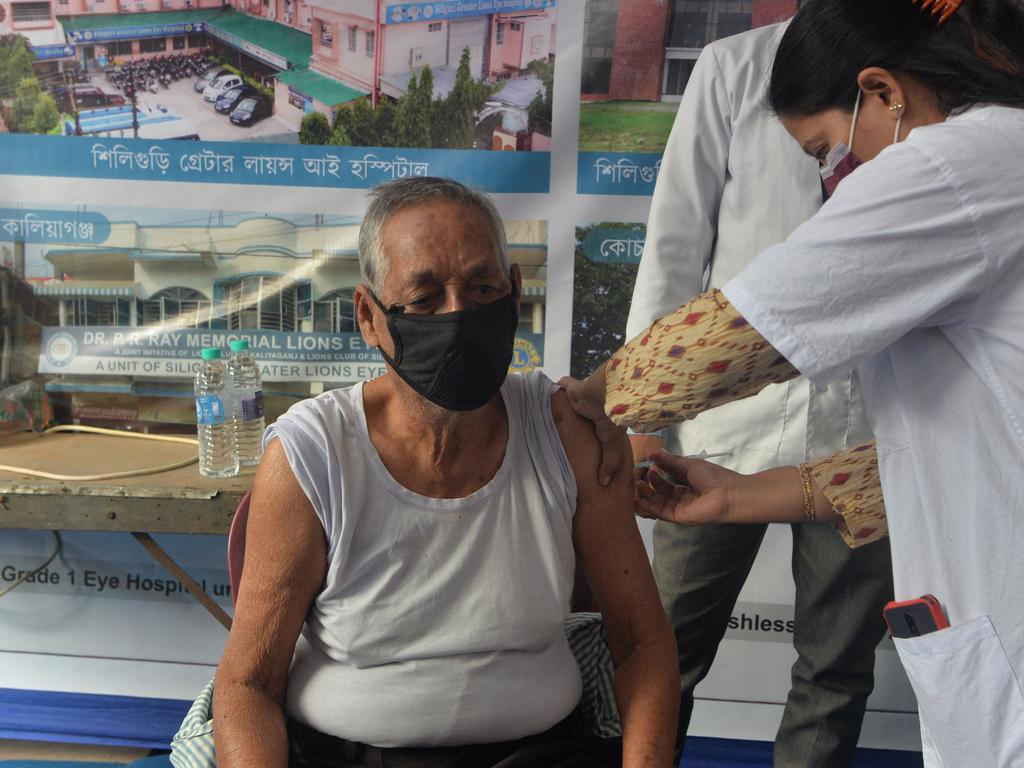 A health worker inoculates a man agains the coronavirus in India. Picture: AFP