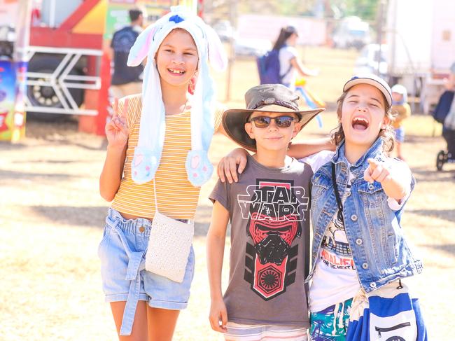 Ruby Bonson, 11, Kai Noakes, 8, and Milly Meddens, 10, enjoying the third and final day of the Royal Darwin Show. Picture: Glenn Campbell