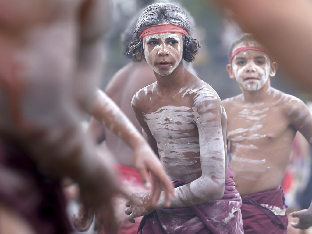 Young members of the Aboriginal community take part in a traditional smoking ceremony that is performed as part of Australia Day celebration in Sydney, Thursday, Jan. 26, 2017. The Aboriginal people perform their ancient custom during Australia Day. (AP Photo/Rick Rycroft)