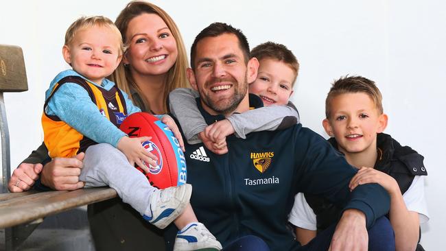 Luke Hodge poses with family after announcing his retirement on the eve of his 300th game. Picture: Getty Images