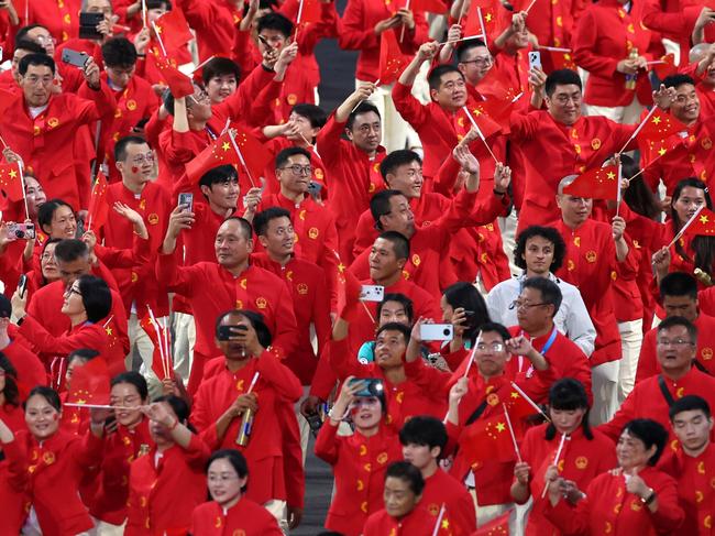 PARIS, FRANCE - AUGUST 28: Athletes of Team People's Republic of China, hold their national flag as they parade during the opening ceremony of the Paris 2024 Summer Paralympic Games at Place de la Concorde on August 28, 2024 in Paris, France. (Photo by Naomi Baker/Getty Images)