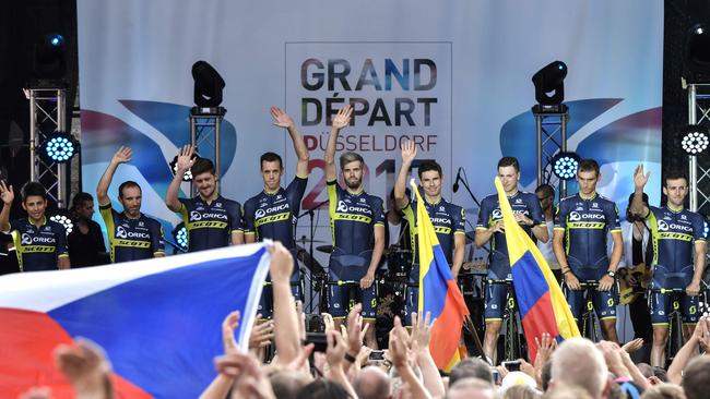 Riders of the Australia's Orica — Scott cycling team stand on stage during the team presentation ceremony in Dusseldorf, Germany ahead of the start of the 104th edition of the Tour de France.