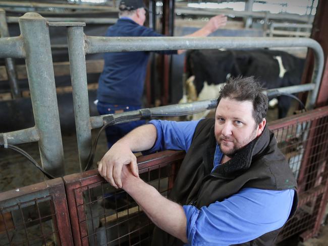 Teal Point dairy farmer Nathan Ferguson is battling on but has had to start carting firewood to Melbourne to survive. Picture: Alex Coppel.