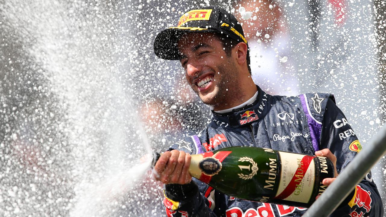 Daniel Ricciardo celebrates on the podium after winning the 2014 Belgian Grand Prix.