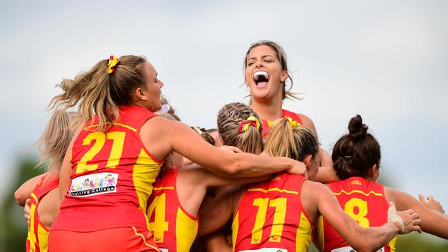 PERTH, AUSTRALIA - MARCH 15: The Suns wrap around Lauren Bella and celebrate the win on the siren during the 2020 AFLW Round 06 match between the West Coast Eagles and the Gold Coast Suns at Mineral Resources Park on March 15, 2020 in Perth, Australia. (Photo by Daniel Carson/AFL Photos via Getty Images)