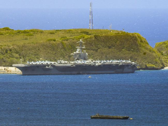 The USS Theodore Roosevelt, a Nimitz-class nuclear powered aircraft carrier, is docked along Kilo Wharf of Naval Base Guam. Picture: Rick Cruz/The Pacific Daily via AP