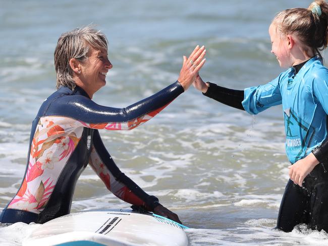 Layne Beachley with Bella Kay, 9. The former world champion surfer was at a Women in Waves day at Clifton Beach in Hobart in January. Picture: Nikki Davis-Jones